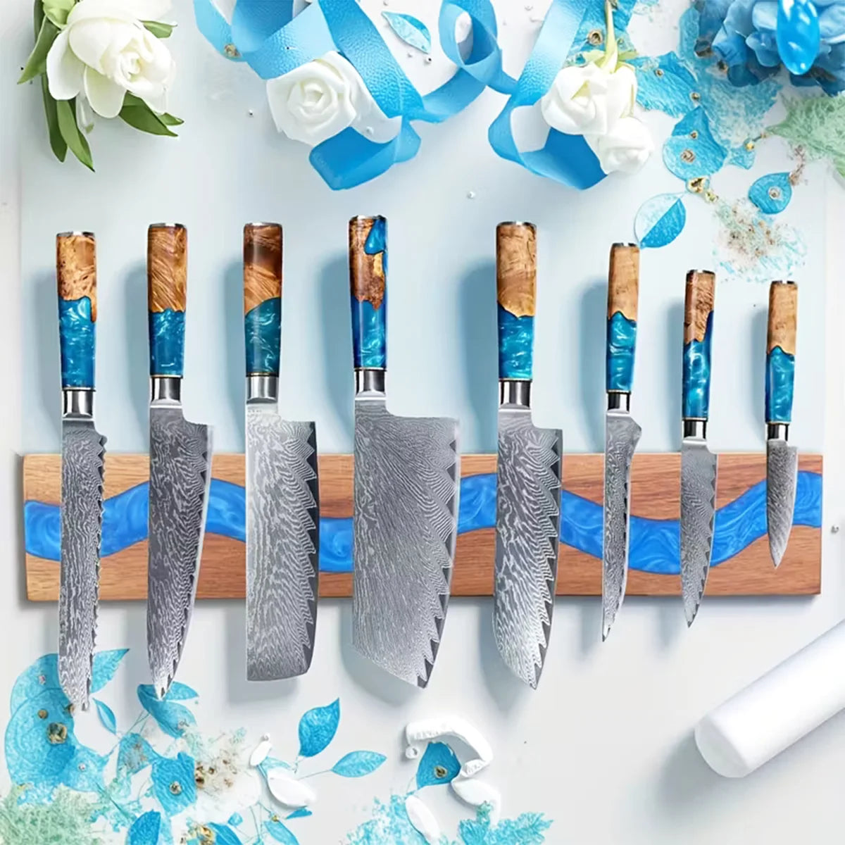 Acacia wood magnetic knife holder with blue resin river displaying premium kitchen knives in a stylish modern kitchen setting