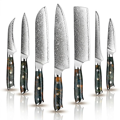 A set of Damascus steel kitchen knives with various blade lengths and wooden handles.