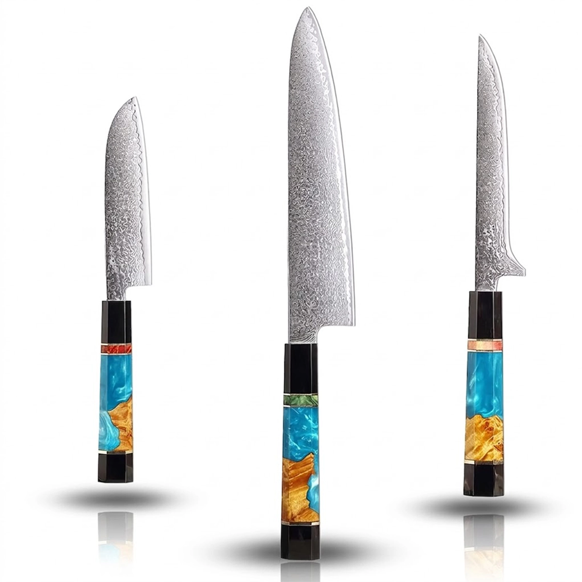 Three knives with decorative handles on a white background