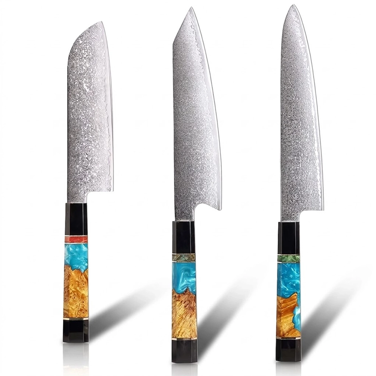 Three knives with decorative handles on a white background