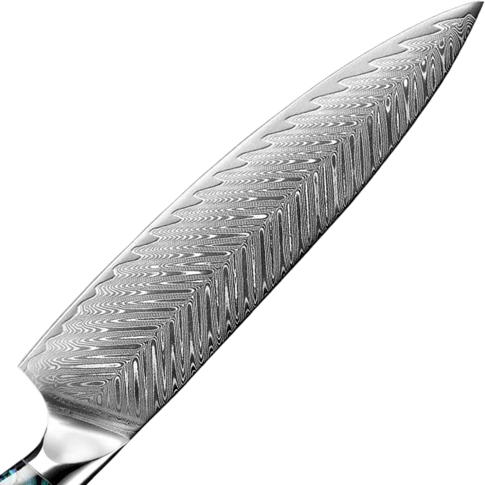 Close-up of a knife blade with a detailed pattern on a white background