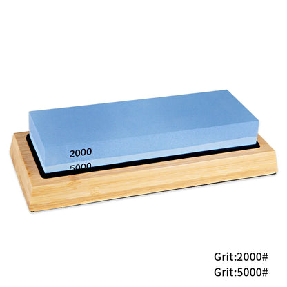 Double-sided whetstone with blue abrasive material on a wooden base