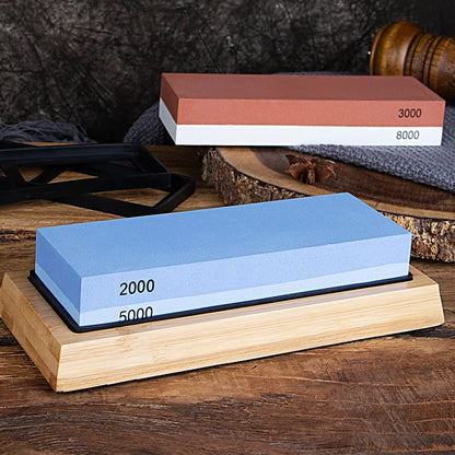 Two whetstones on a wooden stand with a dark background