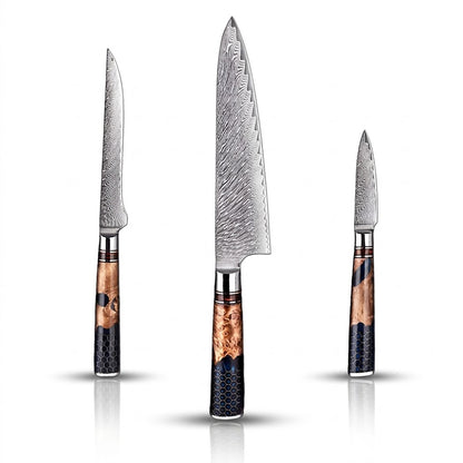 Set of three knives with wooden handles on a white background