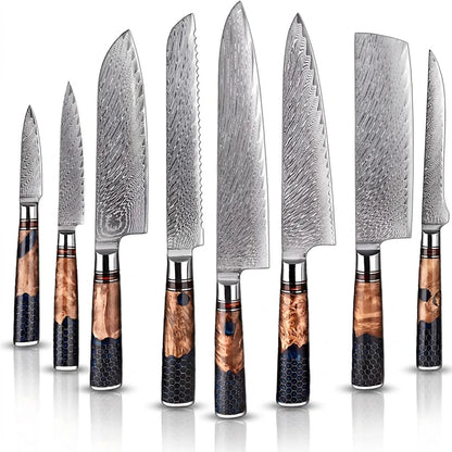 Set of Damascus steel kitchen knives with wooden handles on a white background