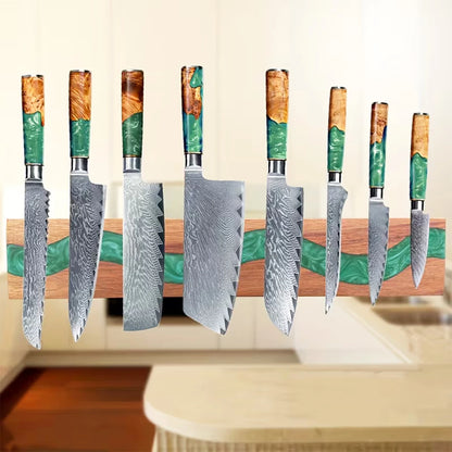 Acacia wood magnetic knife holder with green resin river holding premium kitchen knives on a wall mounted magnetic rack