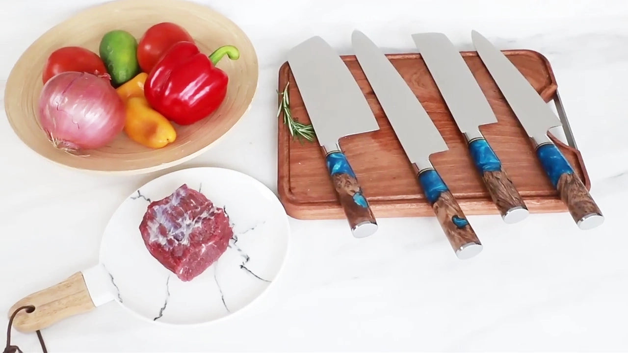 Load video: Japanese VG10 Damascus knife set with blue resin handles cutting food