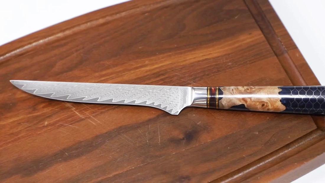 Video demo of 6 inch Damascus steel boning knife with resin wood honeycomb handle and ultra sharp patterned blade for precision meat trimming deboning and kitchen preparation