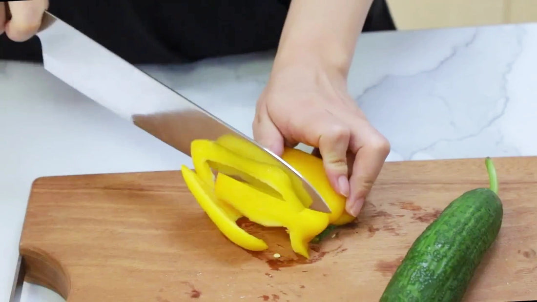 Video demo of 8 inch Damascus steel chef knife with black resin and wood handle featuring an ultra sharp patterned blade for professional kitchen cutting and food preparation