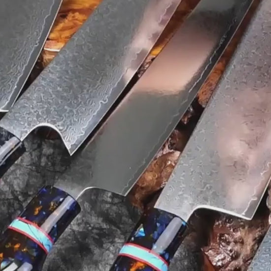 VG10 Damascus kitchen knife chopping vegetables with smooth, precise cuts and blue resin handle