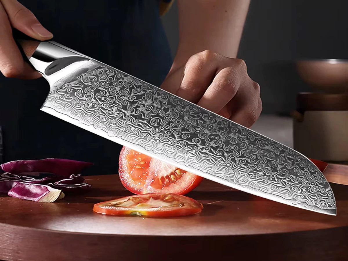 Japanese VG10 Damascus chef knife slicing tomato on wooden board showing sharp edge and blade pattern